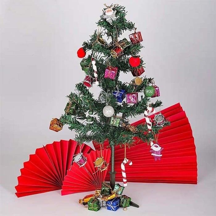 Decorated Christmas tree with ornaments on a white background