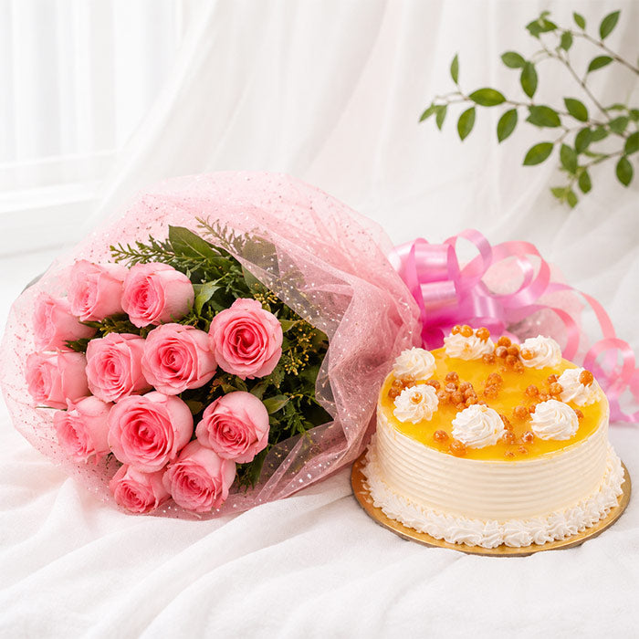 Bouquet of pink roses and a decorated cake on a white background