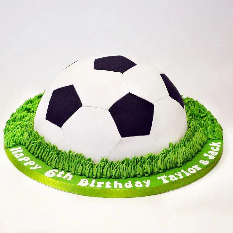 Soccer ball cake with green base and personalized text on a white background