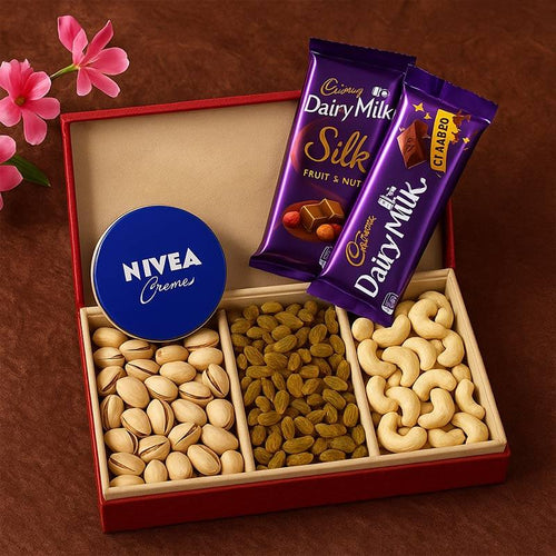Dry fruit gift box with pistachios, raisins, cashews, Nivea cream, and two Dairy Milk chocolates.