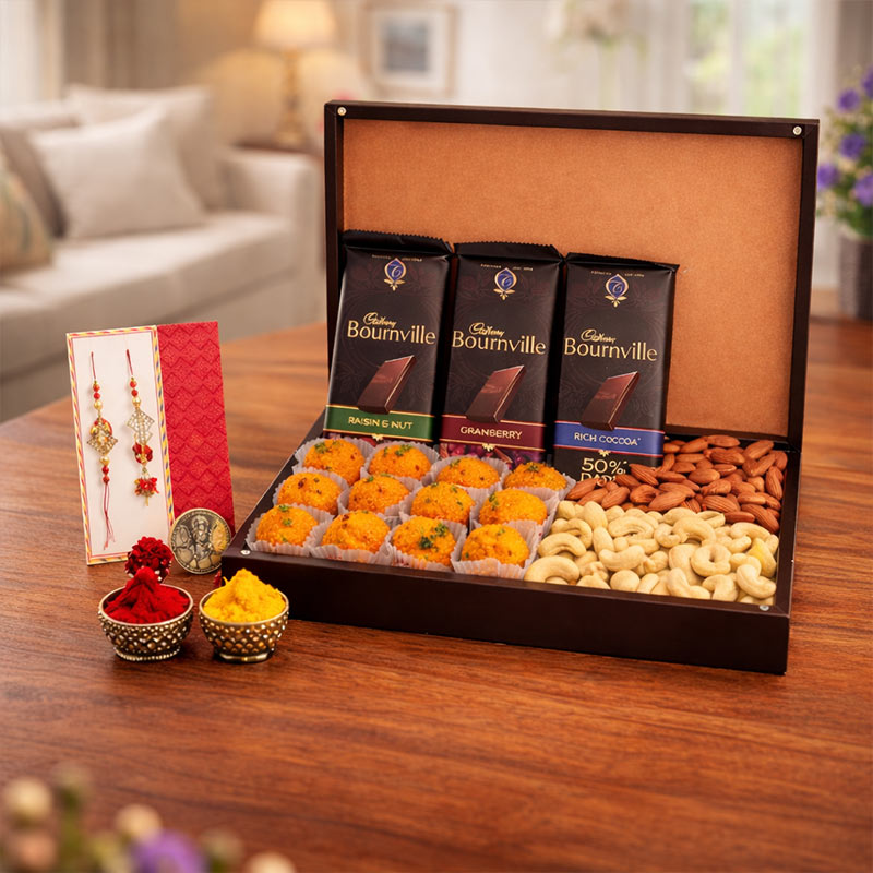 Bournville chocolate box with snacks on a wooden table in a living room setting