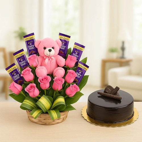 Gift basket with pink roses, Dairy Milk chocolates, pink teddy bear, and chocolate cake
