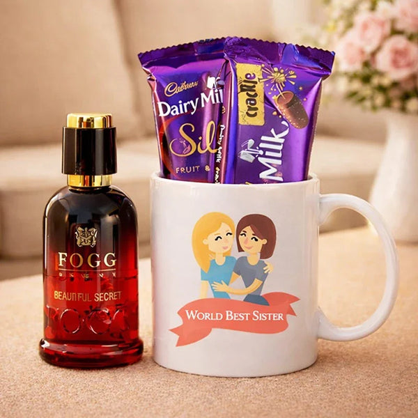 Gift hamper with Fogg perfume, Dairy Milk chocolates, and 'World Best Sister' mug on table