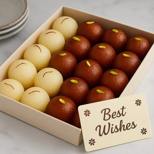 Box of gulab jamuns with a 'Best Wishes' card on a light background