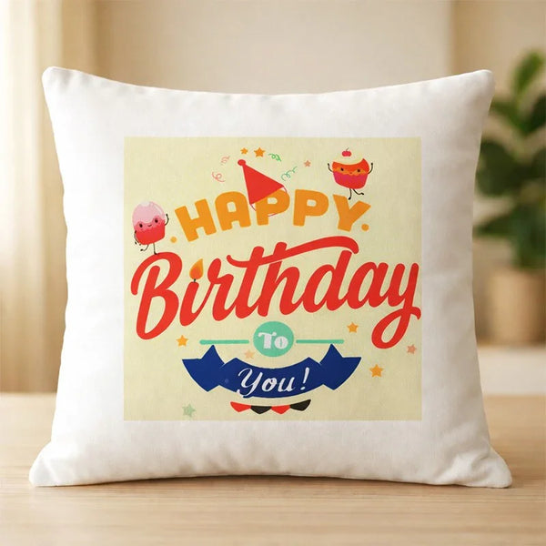 White cushion with colorful Happy Birthday print, cartoon cake, and confetti design.