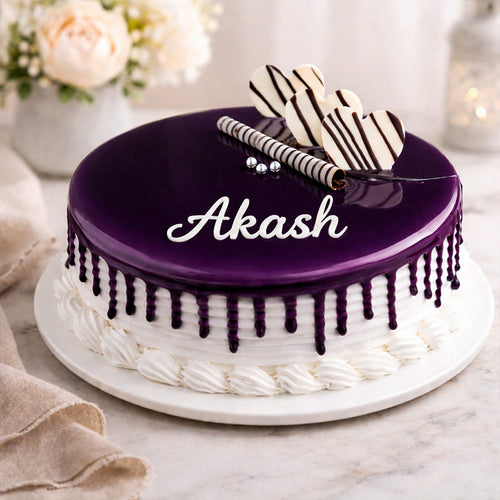 Cake with 'Akash' on top, decorated with purple icing and a zebra-patterned design, placed on a marble surface.