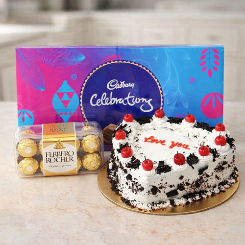 Cake with 'Love you' message and Ferrero Rocher chocolates in front of Cadbury Celebrations packaging.