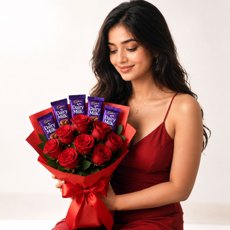 Woman holding a bouquet of red roses and Cadbury Dairy Milk chocolate bars against a white background