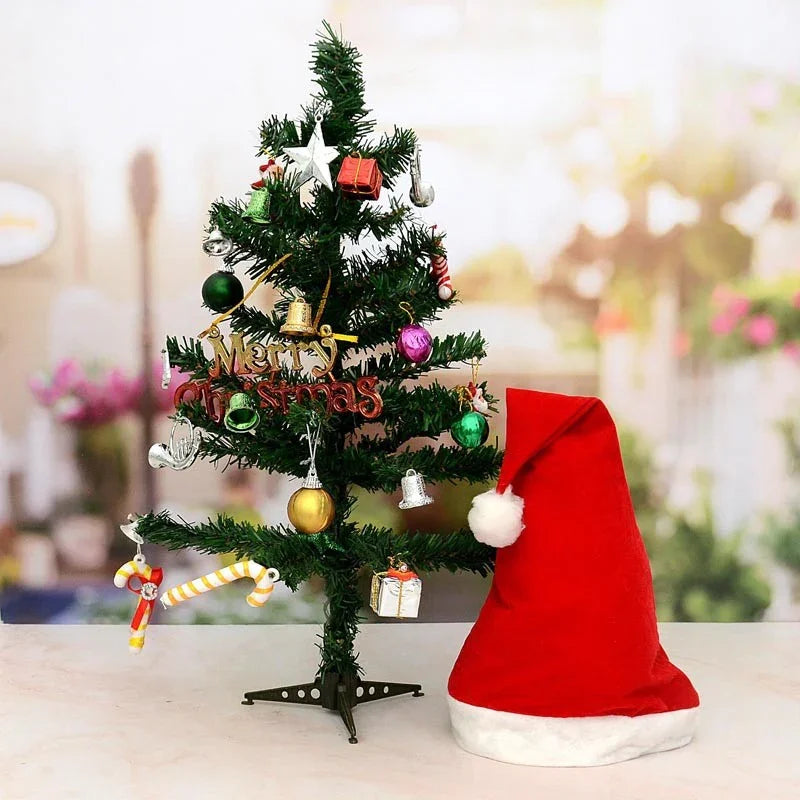 Decorated Christmas tree with ornaments and a Santa hat on a blurred background