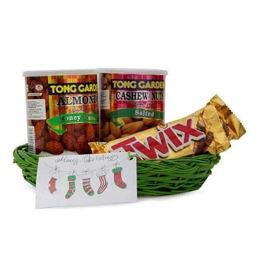 Gift basket with honey almonds, salted cashew nuts, Twix chocolate bar, and festive card