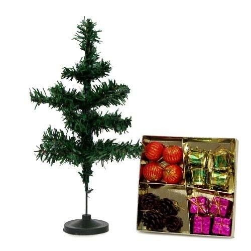 Mini artificial Christmas tree with assorted ornaments and gift decorations