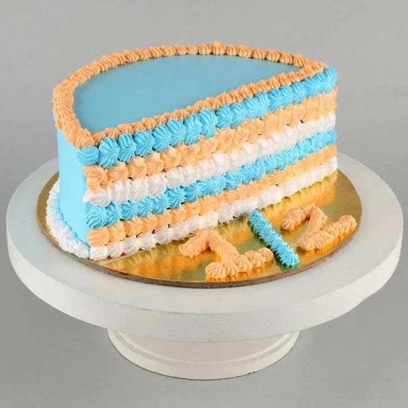 Rectangular cake with blue, orange, and white icing on a gray background