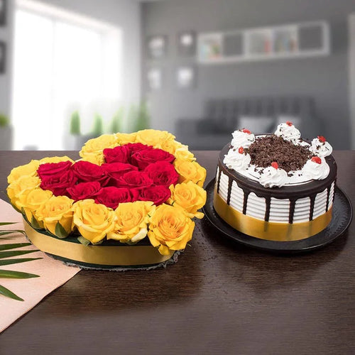 Floral arrangement and a cake on a table with a blurred background