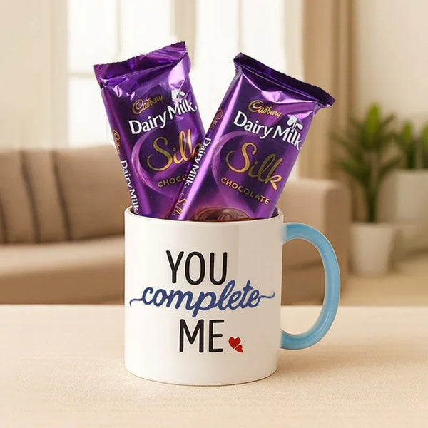 Gift combo with Cadbury Dairy Milk Silk chocolates in a mug reading 'You complete me'