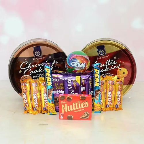 Assorted candy and chocolate bars in a display with branded tins.