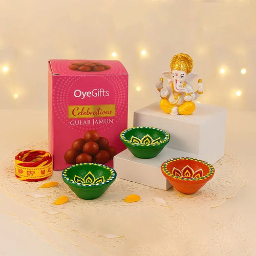 Diwali Celebration Gift Hamper with Gulab Jamun, Lord Ganesha Idol, 3 Decorative Diyas and Mauli Thread Online Gift Delivery