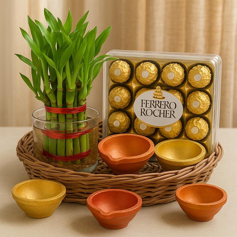 Diwali gift basket with lucky bamboo plant, Ferrero Rocher chocolates, and colorful diyas