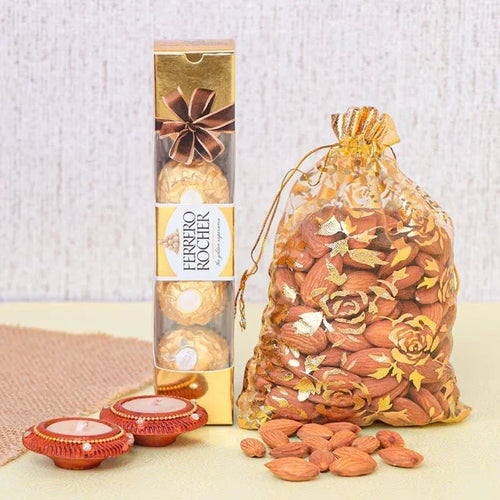 Ferrero Rocher chocolate in a gold box with a transparent bag of almonds on a light background