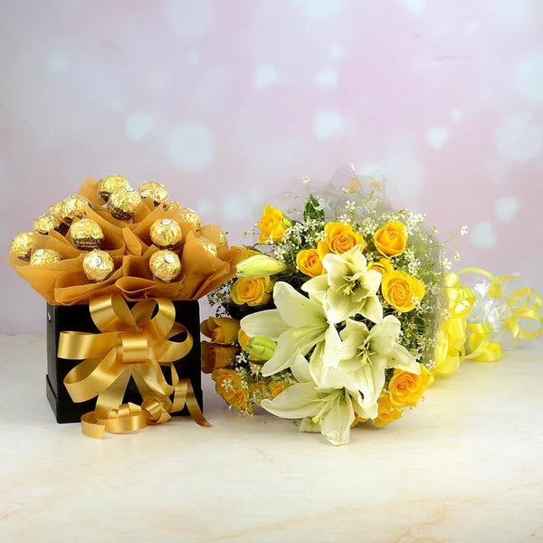 Bouquet of flowers with gold-wrapped chocolates and yellow roses on a light background