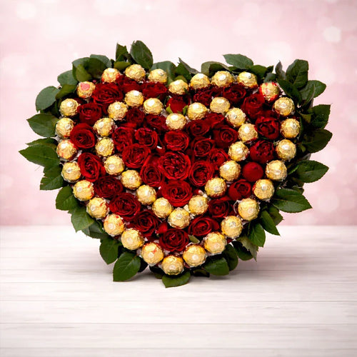 Heart-shaped arrangement of red roses and gold Ferrero Rocher chocolates 