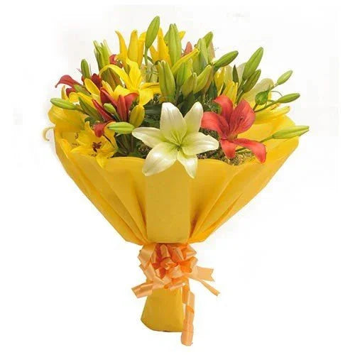 Bright mixed lily flower bouquet wrapped in yellow paper, ideal for gifts and celebrations
