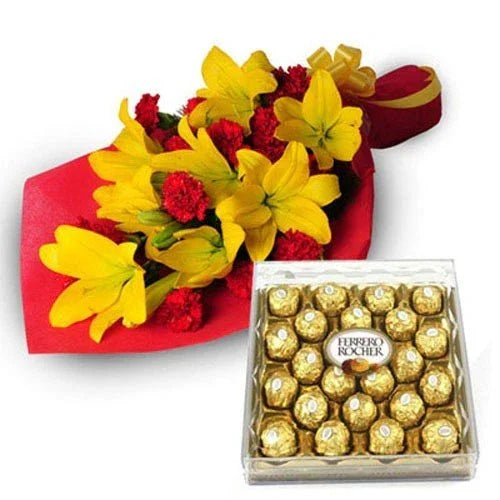 Yellow lilies and red carnations bouquet with a box of Ferrero Rocher chocolates