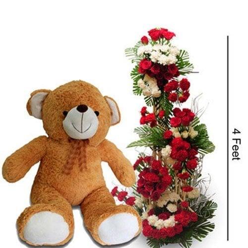 Large brown teddy bear with a 4-foot tall red and white flower arrangement.