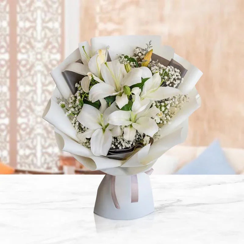Bouquet of white flowers on a stand with a blurred background