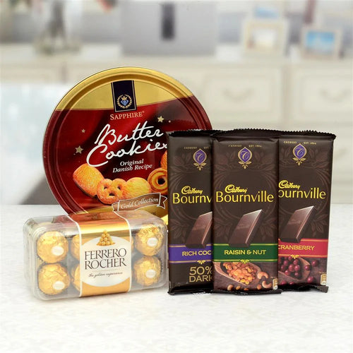 Assorted chocolate and cookie packages including Cadbury Bournville and Ferrero Rocher on a kitchen counter.