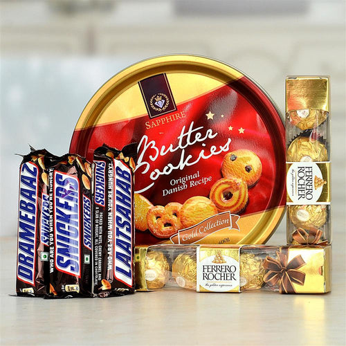 Assorted candy and cookie packaging on a reflective surface
