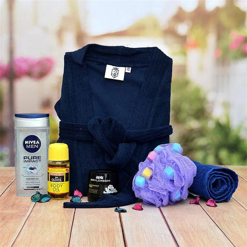 Navy blue robe with Nivea Men products on a wooden surface outdoors.