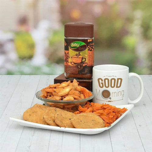 Café Bru coffee jar, mug with 'Good Morning' text, and snacks