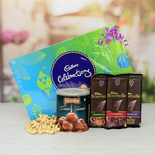 Assorted chocolate and Dry Fruit items including Cadbury Celebrations, Haldiram's Gulab Jamun, and Bourneville chocolate bars on a blurred background.