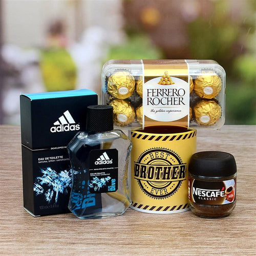 Gift set with Adidas perfume, Ferrero Rocher chocolates, and Nescafe on a wooden surface.