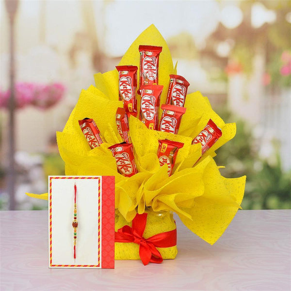 Bouquet of KitKat chocolate bars wrapped in yellow paper with a red ribbon,add rakhi