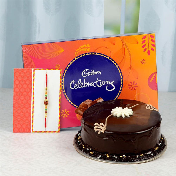 Chocolate cake with a Rakhi, Cadbury Celebrations chocolate bar, and a Rakhi 
