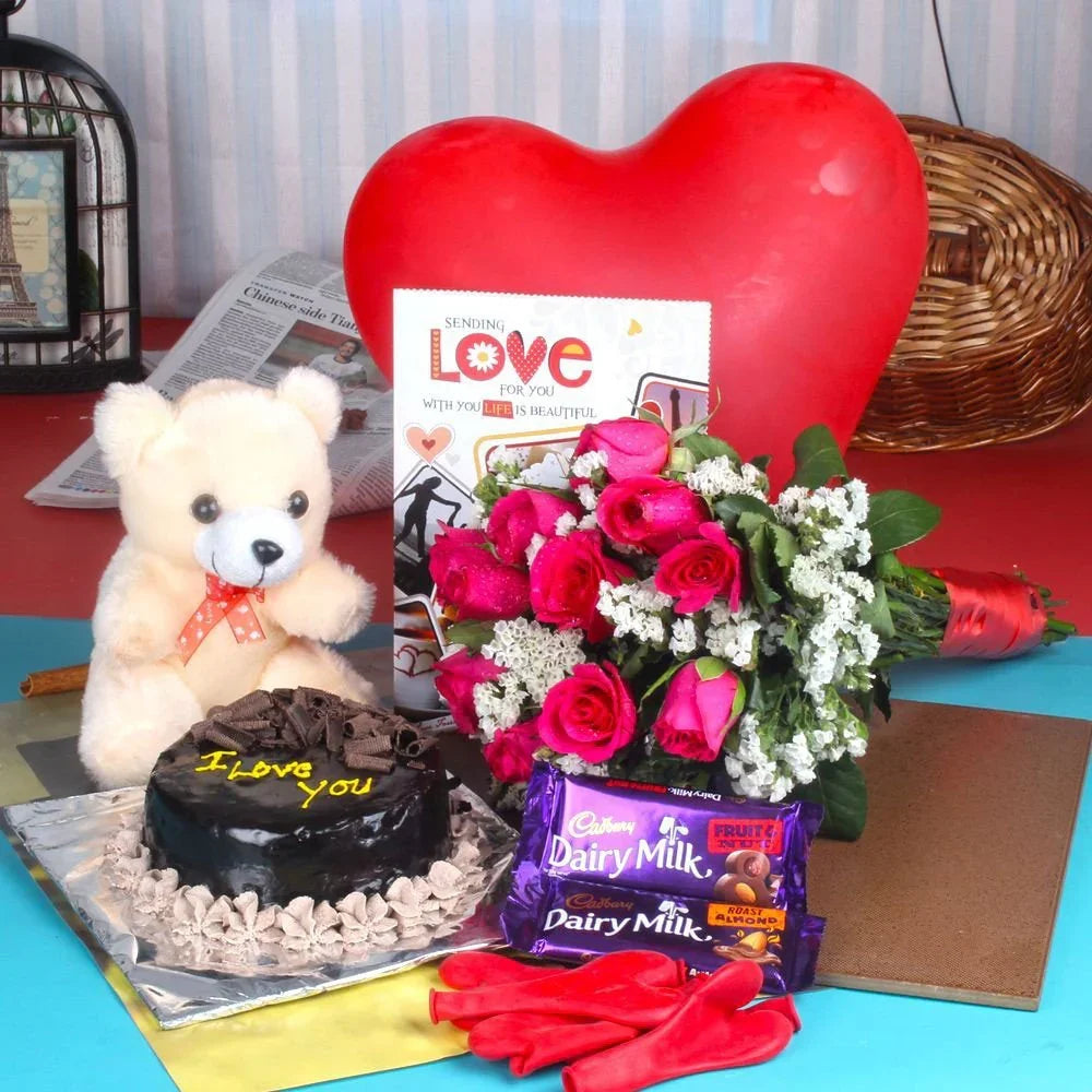 Greeting card with teddy bear, cake, flowers, and chocolate bars