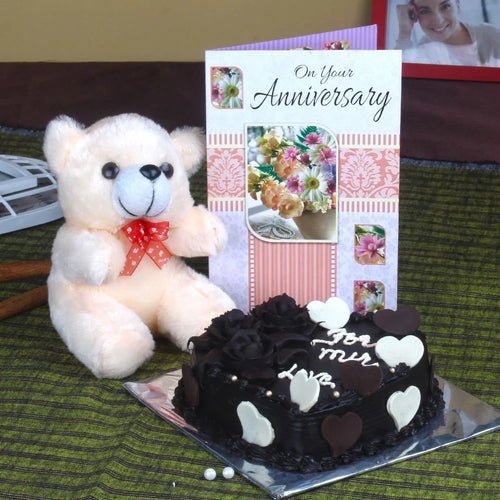 Teddy bear with a card and a cake 