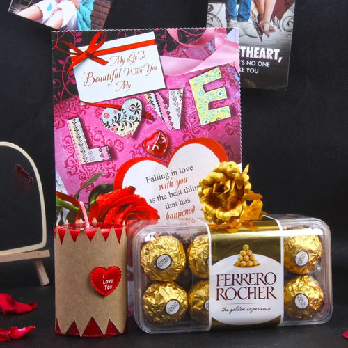 Ferrero Rocher chocolates in a clear candle with decorative cards 