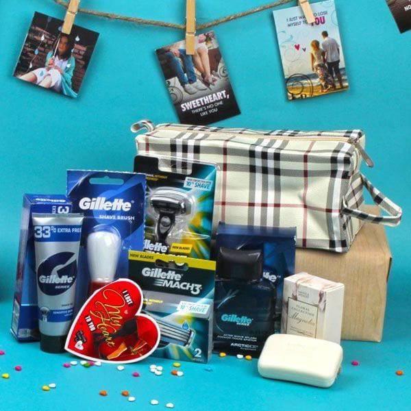 Grooming products including a Gillette razor set and toiletries on a blue background with photos pinned up.