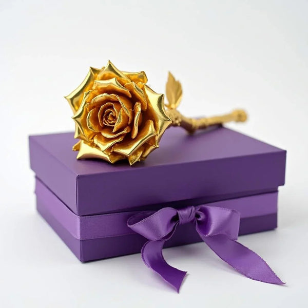 Golden rose ornament on a purple gift box with ribbon, perfect for special occasions.