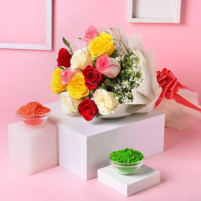 Bouquet of red, yellow, and white roses on a pink background with decorative items.