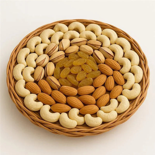Round basket of dry fruits with cashews, almonds, pistachios, and raisins arranged neatly