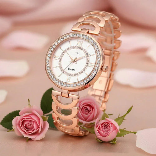 Rose gold watch with diamond accents on a pink floral background