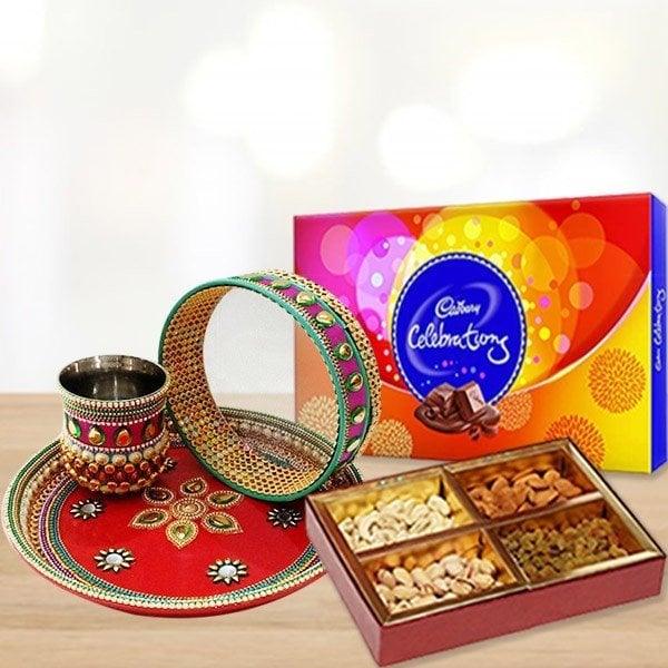Cadbury Celebrations chocolate box with dry fruits and decorative items 