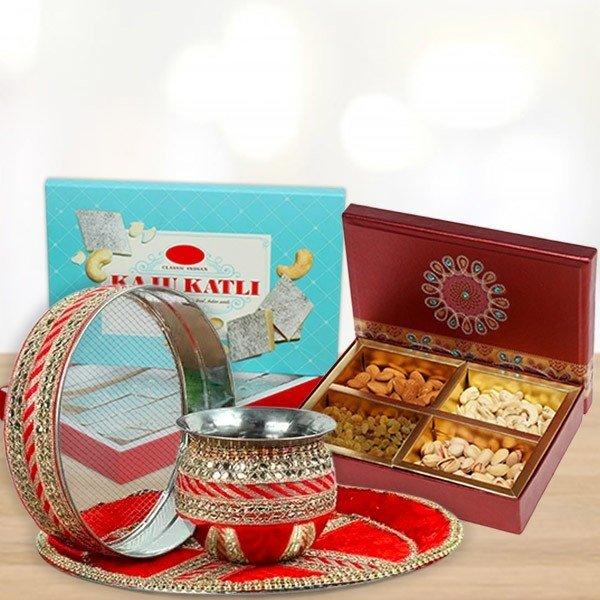 Decorative items including a bowl, tray, and box of dry fruits 