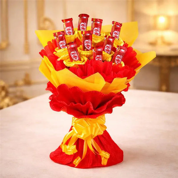 KitKat chocolate bouquet with red and yellow wrapping, arranged as a gift centerpiece.