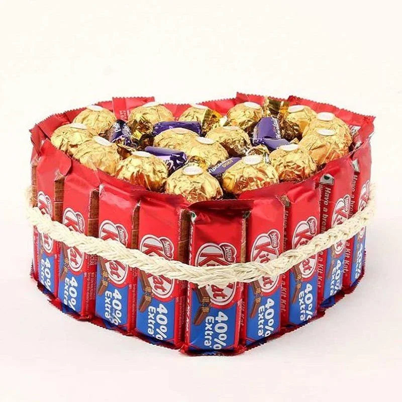 Bouquet of Ferrero Rocher and KitKat chocolate bars on a white background