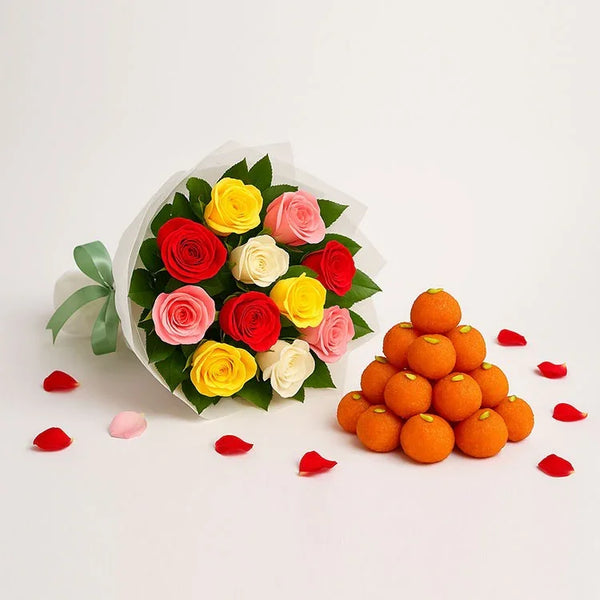 Mixed roses bouquet with ladoos and rose petals, perfect for gifting occasions