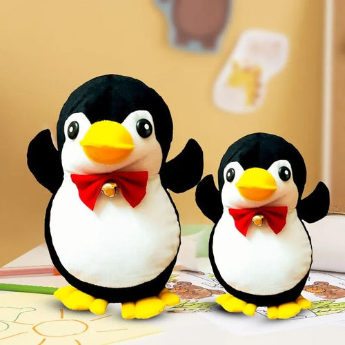 Two plush penguins with red bow ties on a surface with a blurred background